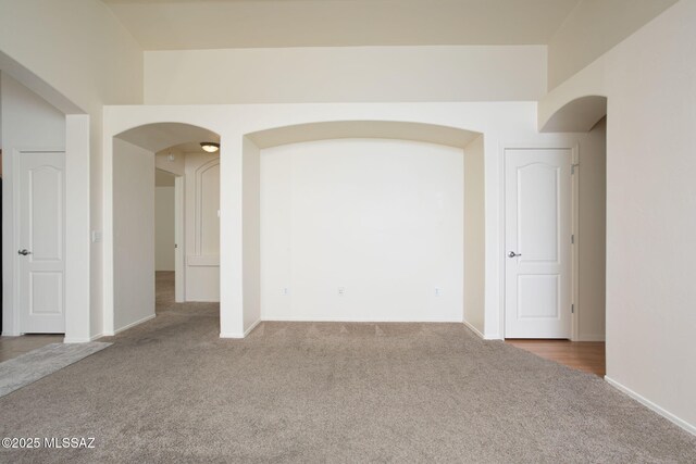 154 W Calle Patio Lindo, Sahuarita, AZ 85629 - spare room featuring carpet floors, arched walkways, and baseboards