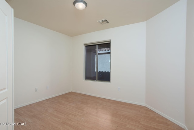 154 W Calle Patio Lindo, Sahuarita, AZ 85629 - unfurnished room with light wood finished floors and baseboards