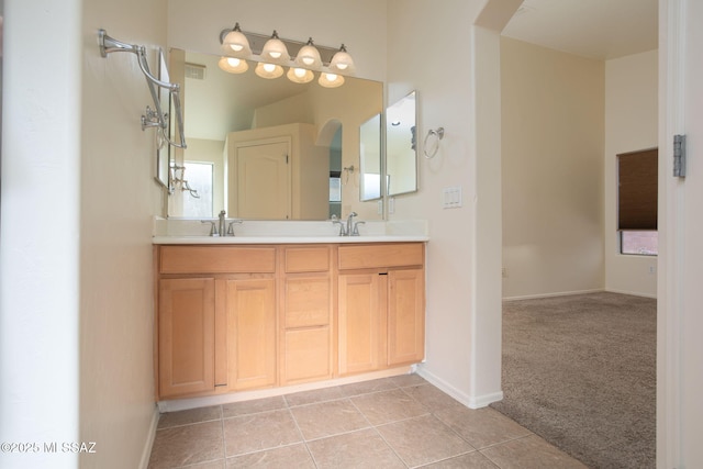 154 W Calle Patio Lindo, Sahuarita, AZ 85629 - bathroom with baseboards, double vanity, and tile patterned floors
