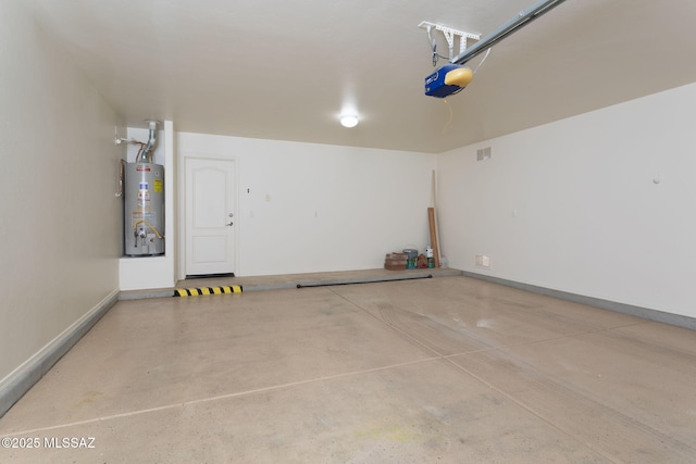 154 W Calle Patio Lindo, Sahuarita, AZ 85629 - garage with gas water heater, a garage door opener, and baseboards