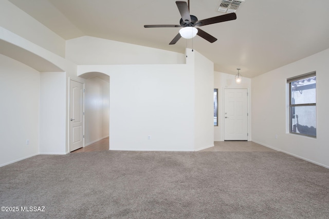 154 W Calle Patio Lindo, Sahuarita, AZ 85629 - unfurnished room featuring vaulted ceiling, light colored carpet, arched walkways, ceiling fan, and baseboards