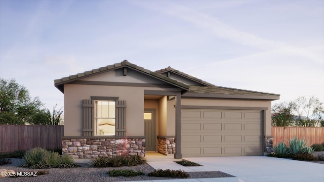 view of front of home featuring stone siding, stucco siding, driveway, and fence