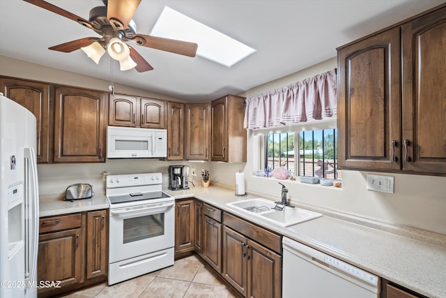 1912 W Anklam Rd, Tucson, AZ 85745 - kitchen with white appliances, a sink, light countertops, light tile patterned flooring, and a ceiling fan