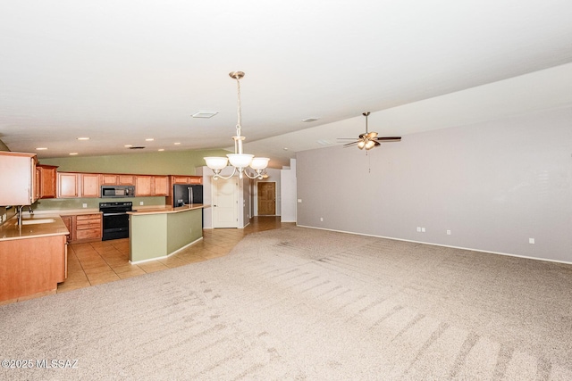 kitchen with electric range, light carpet, black fridge, a sink, and vaulted ceiling