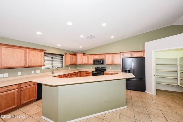 kitchen featuring visible vents, a center island, light countertops, light tile patterned flooring, and black appliances