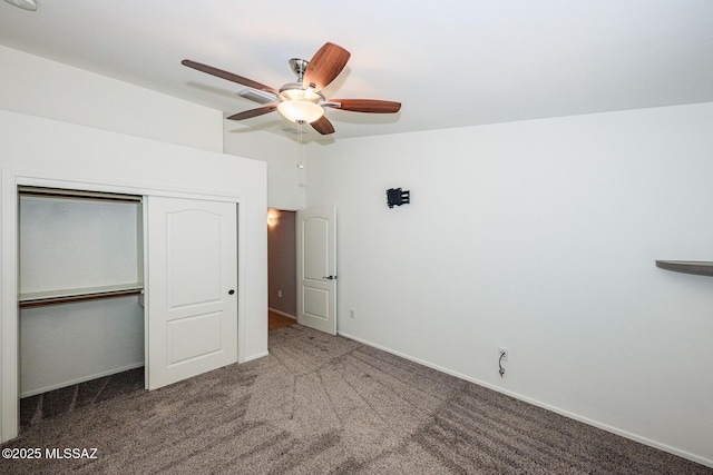 unfurnished bedroom with a ceiling fan, baseboards, carpet floors, lofted ceiling, and a closet