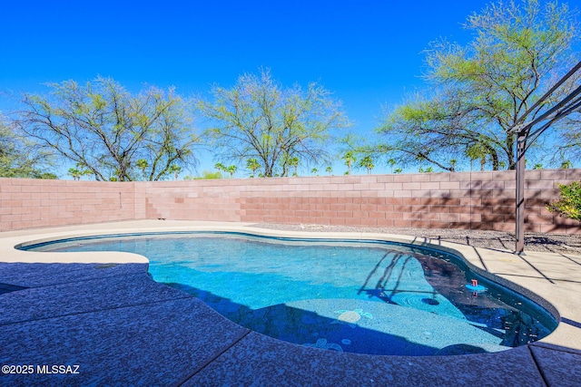 view of swimming pool featuring a fenced in pool and a fenced backyard