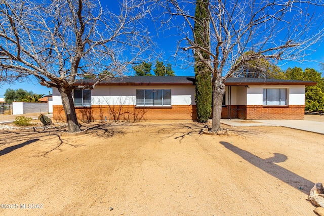 ranch-style home with brick siding
