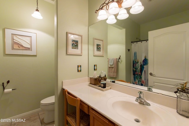 14938 N Gwynns Run Dr, Tucson, AZ 85739 - full bathroom featuring toilet, vanity, a chandelier, tile patterned floors, and baseboards
