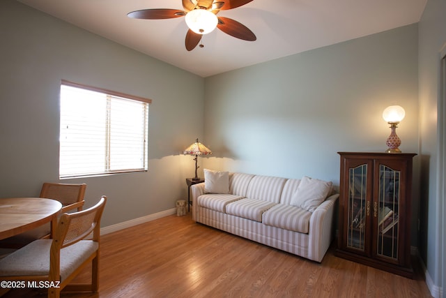 14938 N Gwynns Run Dr, Tucson, AZ 85739 - living area featuring baseboards, ceiling fan, and wood finished floors