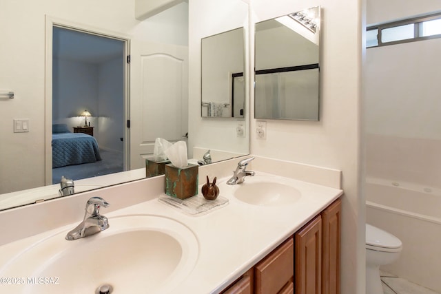 14938 N Gwynns Run Dr, Tucson, AZ 85739 - full bathroom with connected bathroom, toilet, and double vanity
