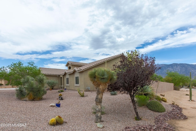 14938 N Gwynns Run Dr, Tucson, AZ 85739 - view of front of property featuring stucco siding, a mountain view, and a tiled roof