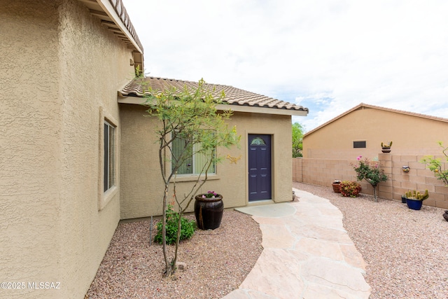 14938 N Gwynns Run Dr, Tucson, AZ 85739 - entrance to property featuring stucco siding and a tile roof