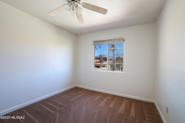 unfurnished room featuring carpet floors, a ceiling fan, and baseboards