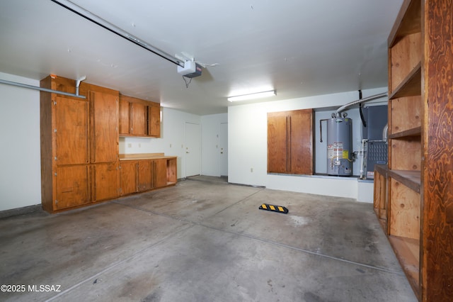 garage featuring a garage door opener and gas water heater