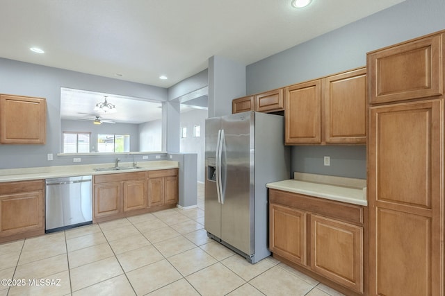20868 E Treasure Rd, Red Rock, AZ 85145 - kitchen featuring a ceiling fan, a sink, stainless steel appliances, light countertops, and light tile patterned floors