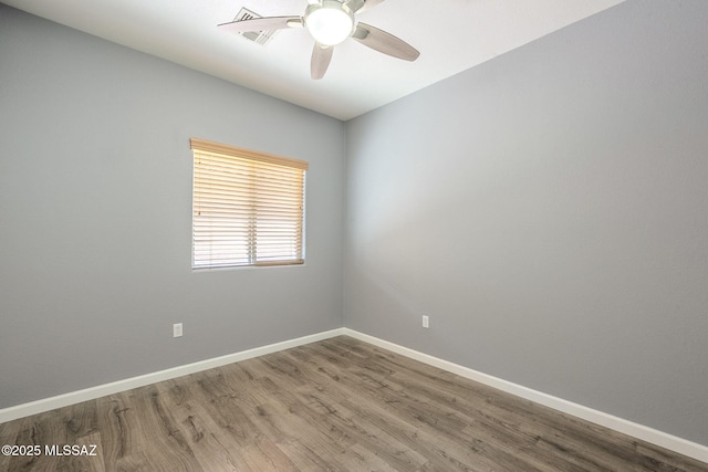 20868 E Treasure Rd, Red Rock, AZ 85145 - spare room with wood finished floors, baseboards, and ceiling fan