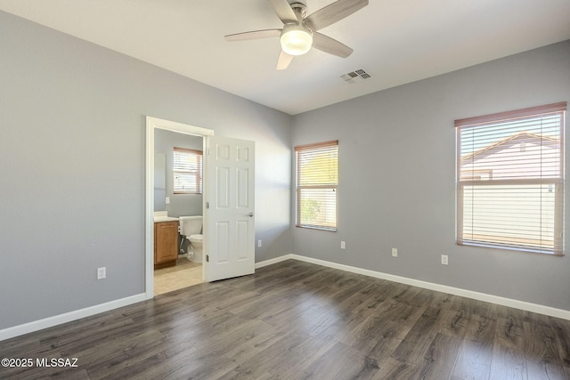 20868 E Treasure Rd, Red Rock, AZ 85145 - unfurnished bedroom with visible vents, baseboards, and wood finished floors