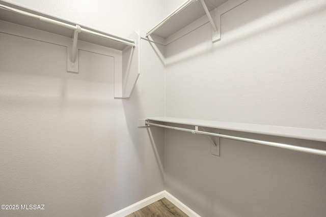 20868 E Treasure Rd, Red Rock, AZ 85145 - spacious closet with wood finished floors