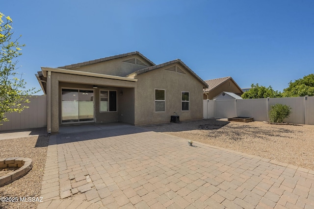 20868 E Treasure Rd, Red Rock, AZ 85145 - back of house with a patio area, a fenced backyard, and stucco siding