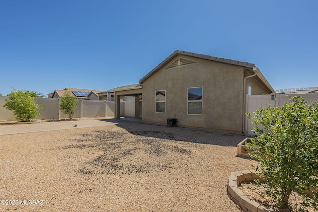 20868 E Treasure Rd, Red Rock, AZ 85145 - rear view of property with a patio, cooling unit, a garden, a fenced backyard, and stucco siding