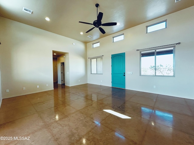 9505 S Deer Ridge Trl, Hereford, AZ 85615 - unfurnished room featuring baseboards, visible vents, ceiling fan, and a high ceiling
