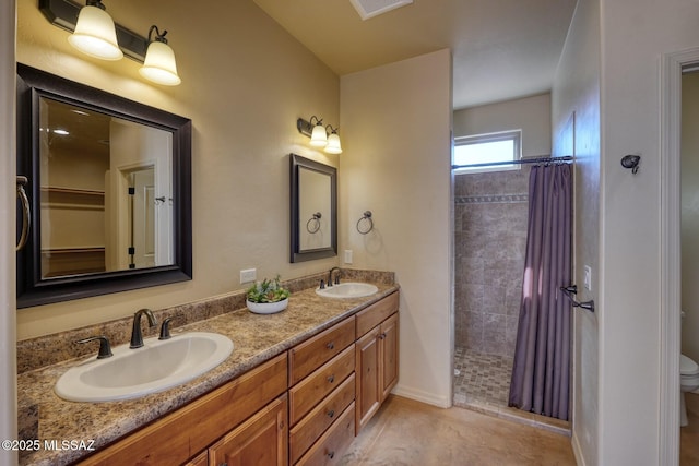 9505 S Deer Ridge Trl, Hereford, AZ 85615 - full bath with toilet, a tile shower, double vanity, and a sink