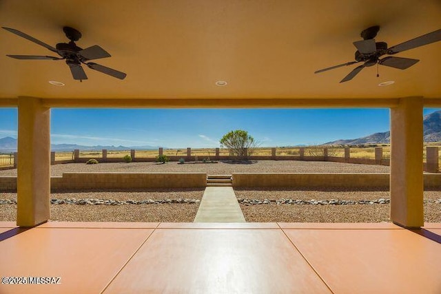 9505 S Deer Ridge Trl, Hereford, AZ 85615 - view of patio featuring ceiling fan, a mountain view, and a fenced backyard