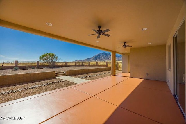 9505 S Deer Ridge Trl, Hereford, AZ 85615 - view of patio with a ceiling fan, a mountain view, and a fenced backyard