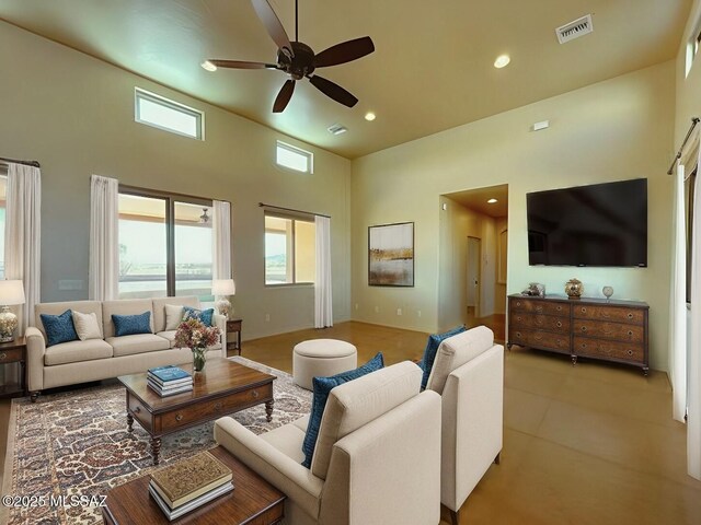 9505 S Deer Ridge Trl, Hereford, AZ 85615 - living room featuring recessed lighting, tile patterned flooring, visible vents, a ceiling fan, and a high ceiling