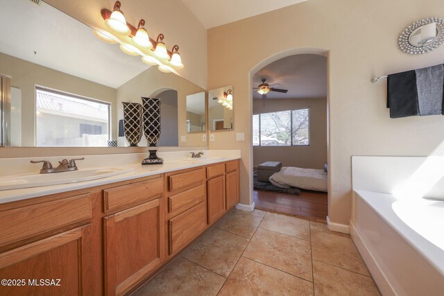 8418 N Sayante Way, Tucson, AZ 85743 - full bath with tile patterned floors, a sink, double vanity, and ceiling fan