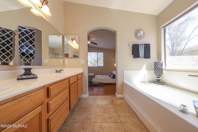 8418 N Sayante Way, Tucson, AZ 85743 - full bath featuring vanity, a garden tub, tile patterned flooring, ensuite bath, and baseboards