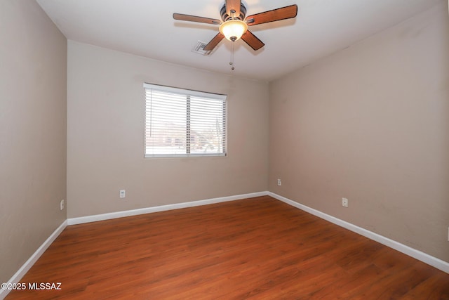8418 N Sayante Way, Tucson, AZ 85743 - empty room with a ceiling fan, visible vents, baseboards, and wood finished floors