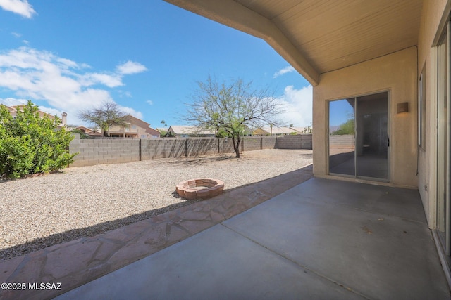 8418 N Sayante Way, Tucson, AZ 85743 - view of patio / terrace featuring a fire pit and a fenced backyard