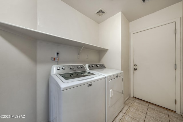 9379 E Grapevine Spring Pl, Tucson, AZ 85710 - washroom featuring independent washer and dryer and light tile patterned floors