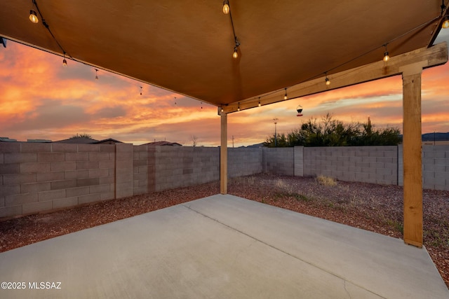 9379 E Grapevine Spring Pl, Tucson, AZ 85710 - fenced backyard featuring a patio area