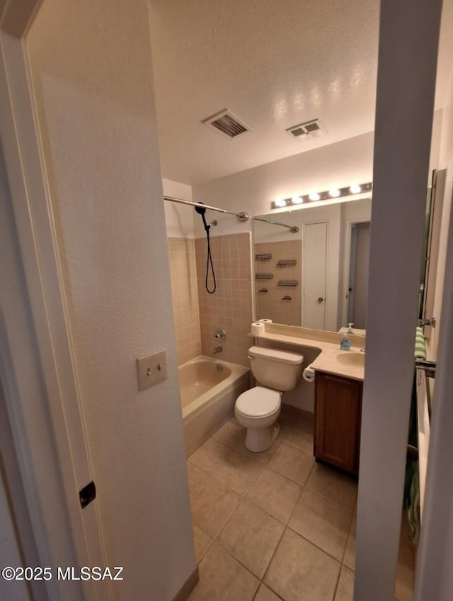 bathroom featuring bathtub / shower combination, visible vents, toilet, and tile patterned flooring