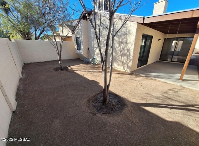 exterior space featuring a fenced backyard and a patio area