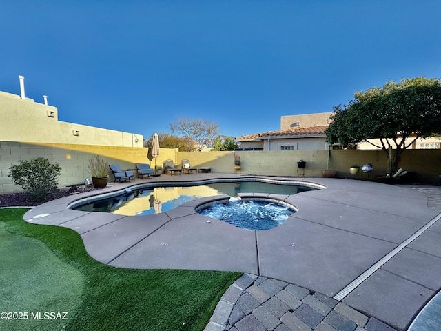 view of pool with a fenced backyard, a fenced in pool, an in ground hot tub, and a patio