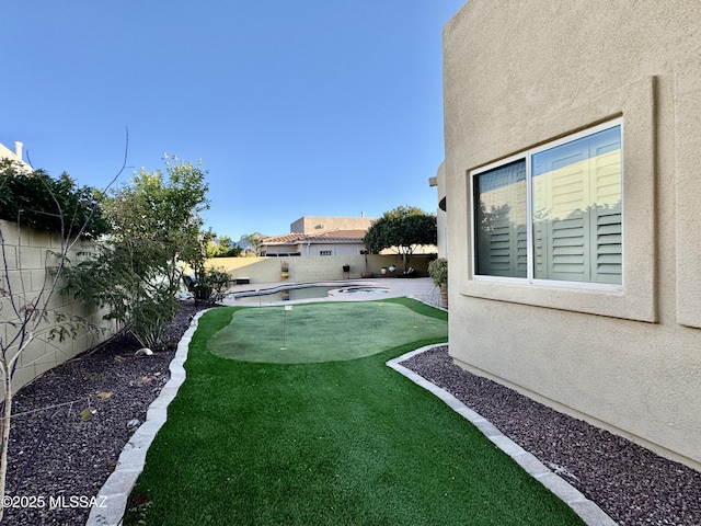view of yard featuring a patio and a fenced backyard
