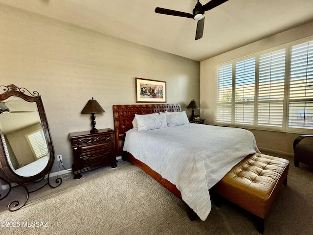 bedroom with carpet, baseboards, and ceiling fan