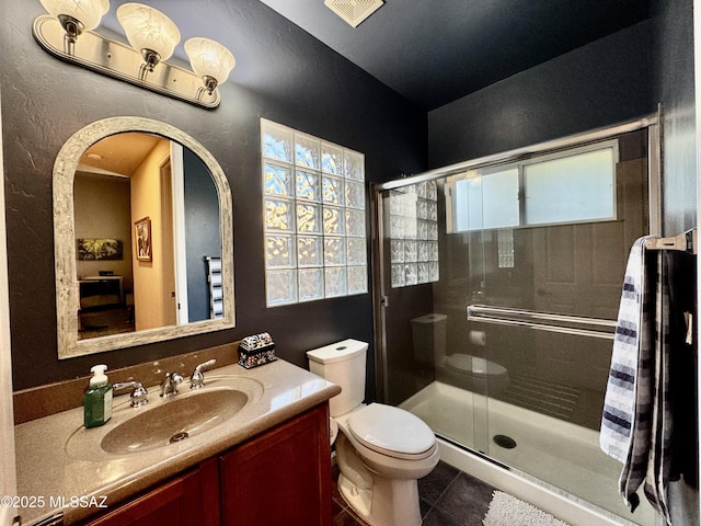 full bath with visible vents, a stall shower, tile patterned floors, and toilet