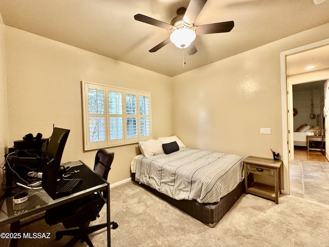 bedroom featuring baseboards, ceiling fan, and carpet flooring
