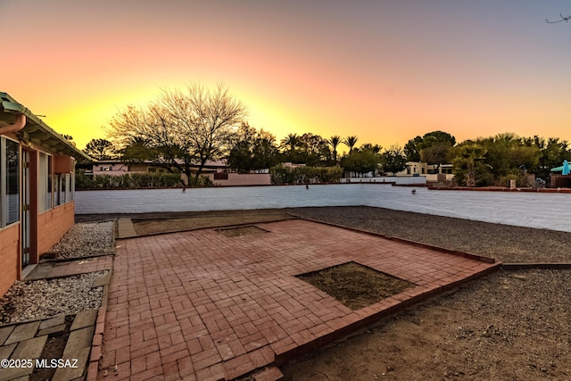 view of patio terrace at dusk