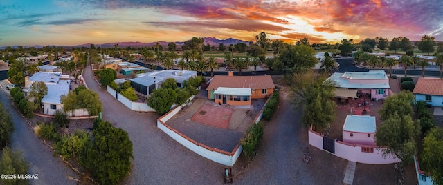 aerial view at dusk with a residential view and a mountain view