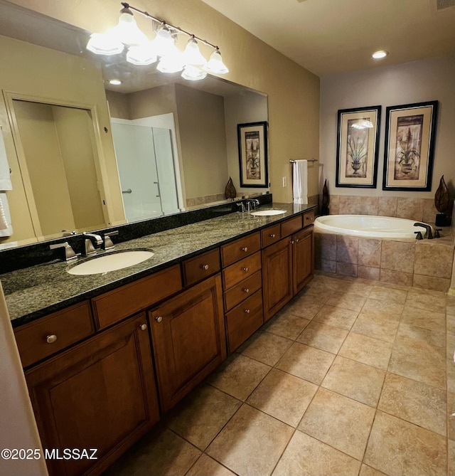 5775 S Camino Del Sol Unit 6104, Green Valley, AZ 85622 - full bath with double vanity, a garden tub, and tile patterned flooring