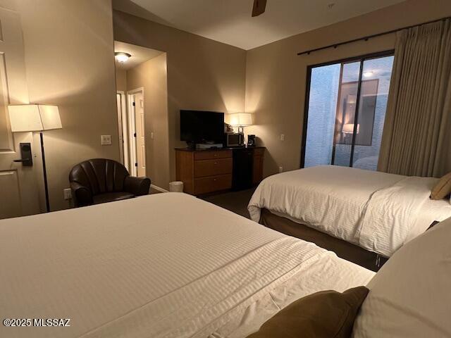 5775 S Camino Del Sol Unit 6104, Green Valley, AZ 85622 - bedroom with access to outside and a ceiling fan