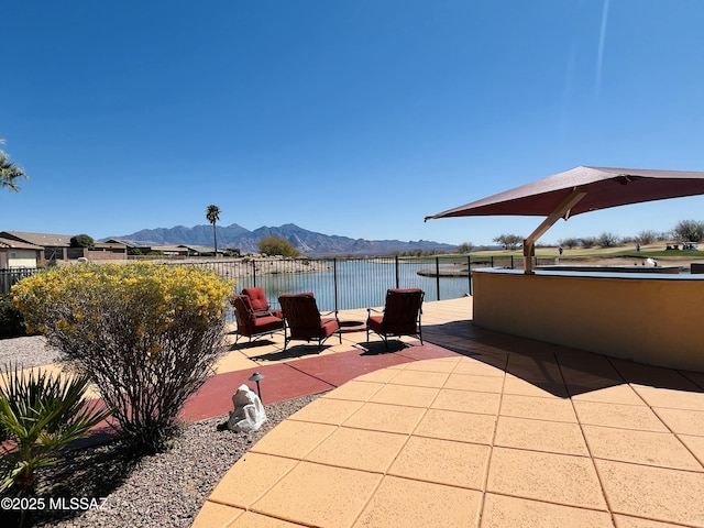 5775 S Camino Del Sol Unit 6104, Green Valley, AZ 85622 - view of patio / terrace with a water and mountain view