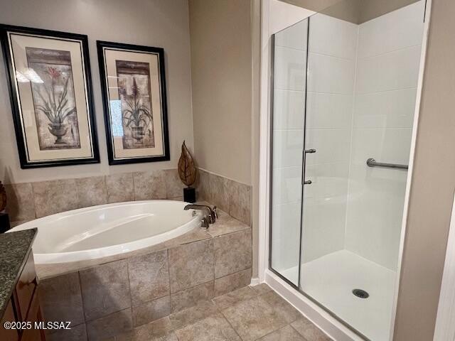 5775 S Camino Del Sol Unit 6104, Green Valley, AZ 85622 - bathroom with a garden tub, a stall shower, vanity, and tile patterned flooring