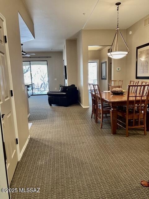 5775 S Camino Del Sol Unit 6104, Green Valley, AZ 85622 - dining room featuring carpet floors, a ceiling fan, and baseboards